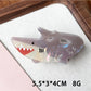 Beau claw clip placed on a flat surface highlighting detailed marine print