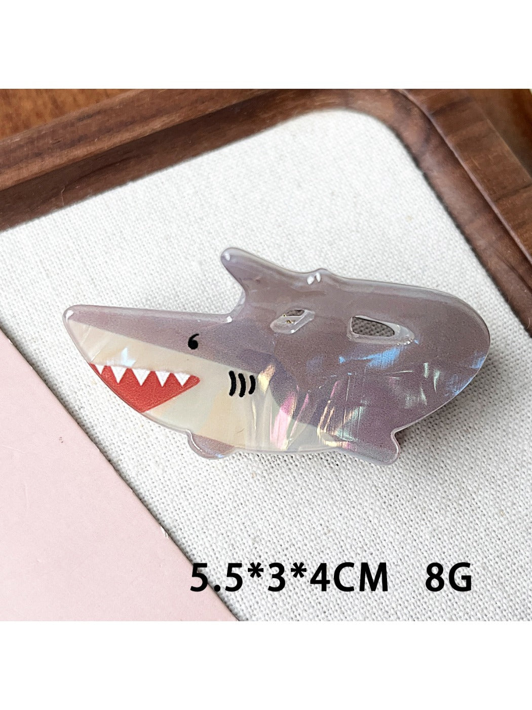 Beau claw clip placed on a flat surface highlighting detailed marine print
