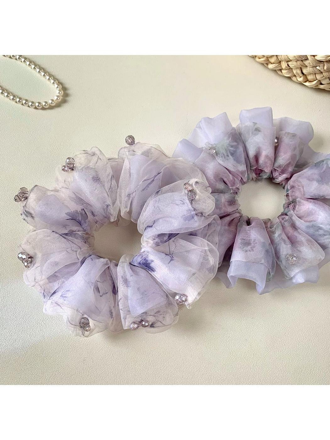 Side view of Gifty purple scrunchie highlighting gathered fabric design