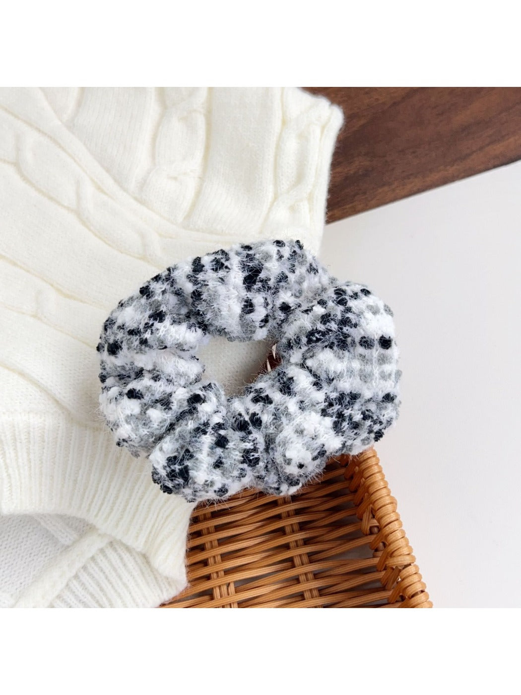 Close-up of a blue scrunchie with a floral print