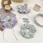 Plaid scrunchie headband and matching hair clip on white background