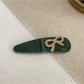 Beau - Bow Embellished Oval Hair Clip