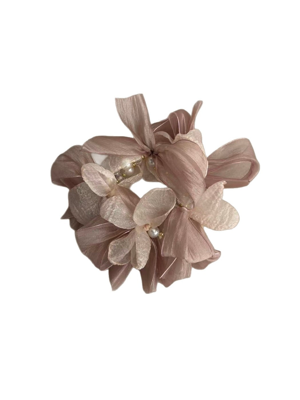 Close-up of the pink bow detail on the Gifty scrunchie showing fabric texture