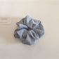 Multiple Gifty scrunchies stacked to show pattern and fabric details