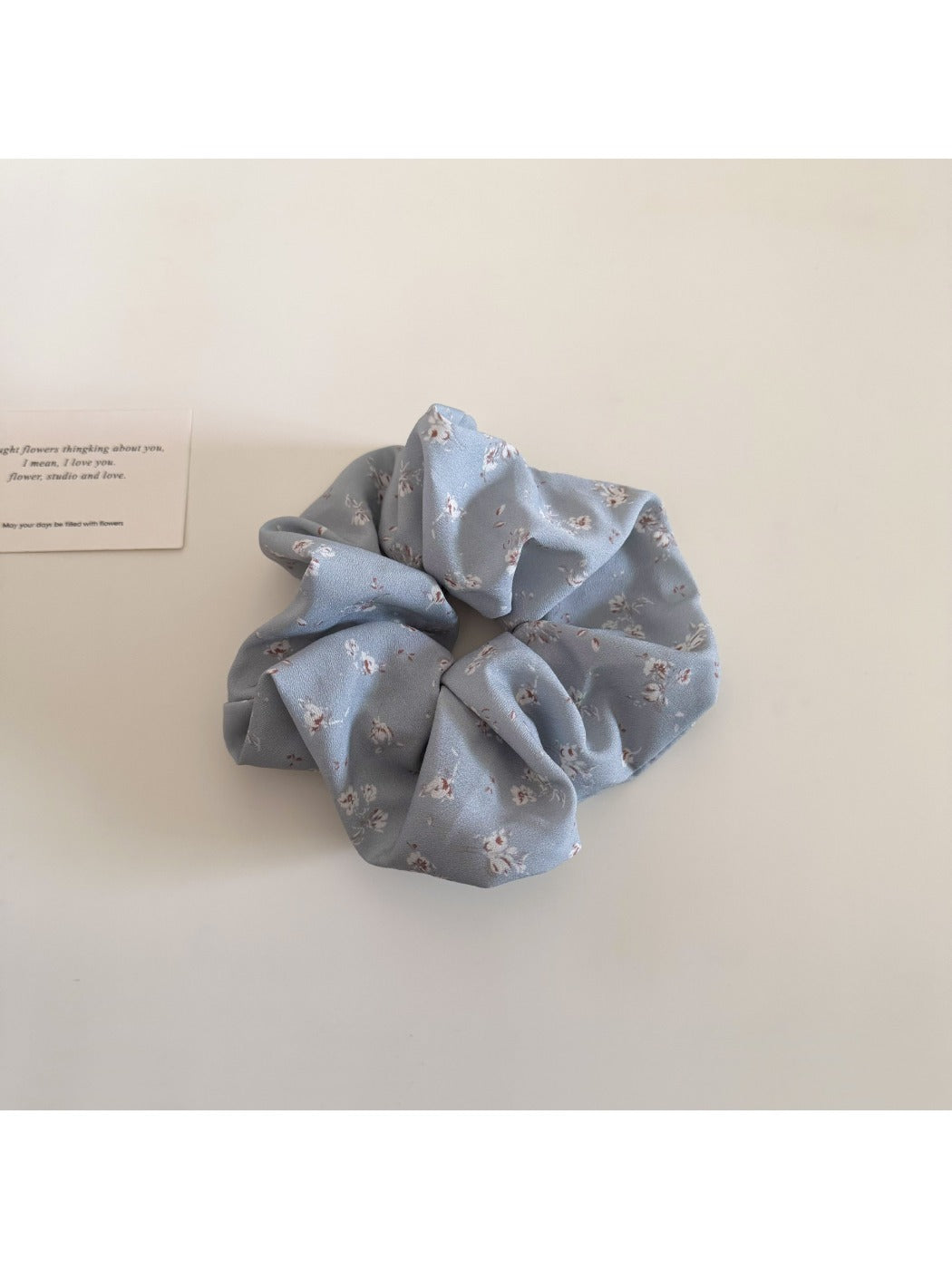 Multiple Gifty scrunchies stacked to show pattern and fabric details