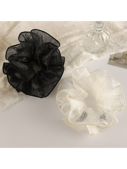 Close-up of Gifty minimalist double layer ruffled scrunchie in soft pink fabric