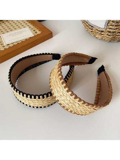 Side view of model wearing Gifty wide headband with loose hair