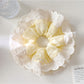 Gifty polka dot scrunchie displayed on a wooden surface showing fabric texture