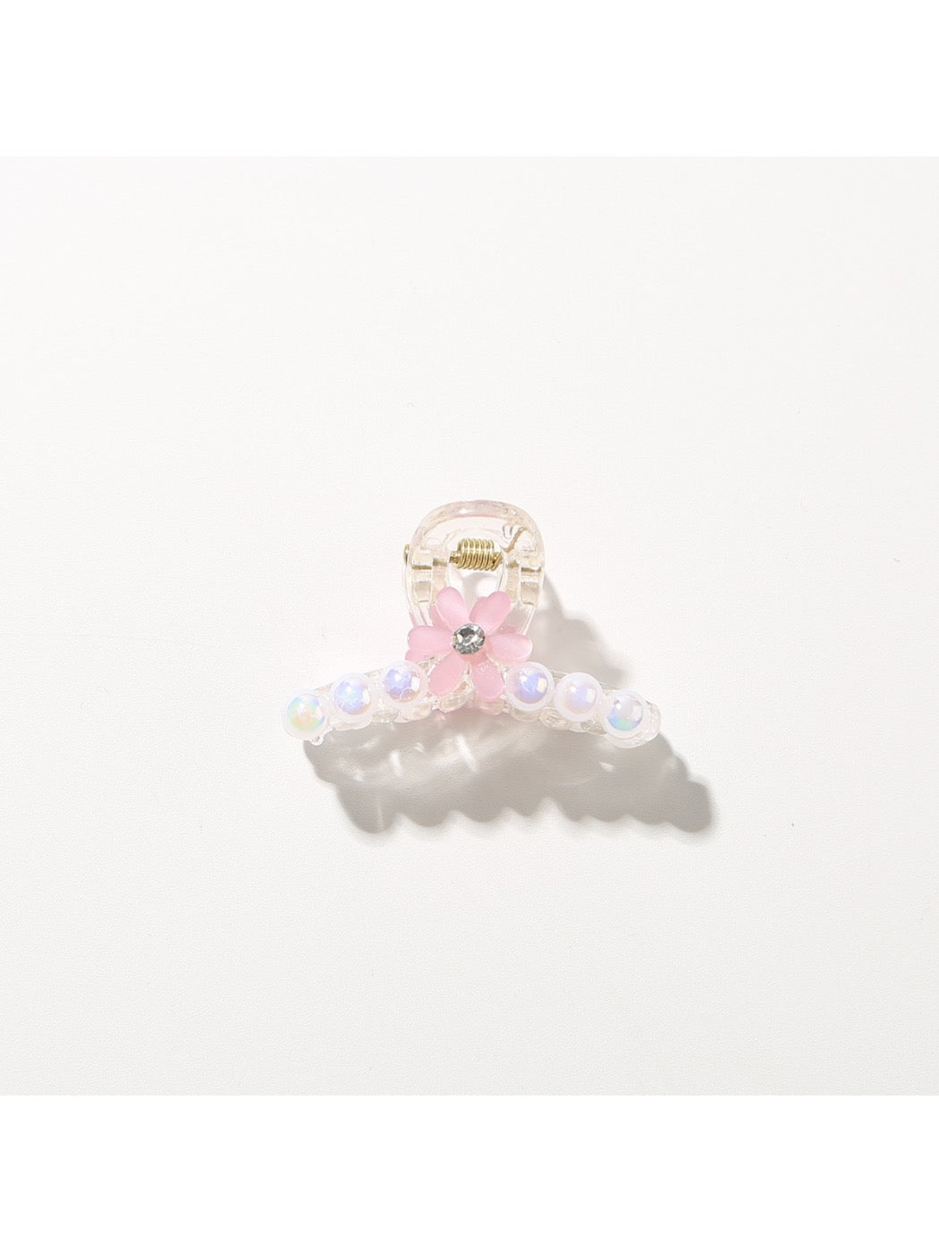 Bright multi color hair clip shown in natural outdoor light