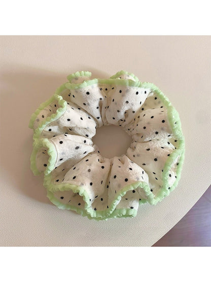 Close-up of Gifty Sweet Polka Dot Ruffled Scrunchie in pink with white dots