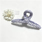Beau plaid fabric wrapped claw clip displayed on white background