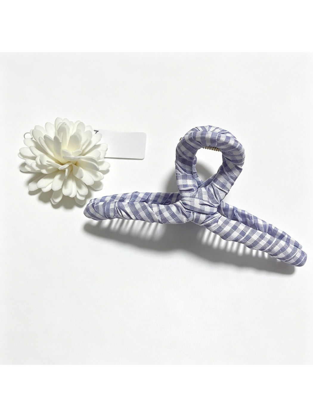 Beau plaid fabric wrapped claw clip displayed on white background
