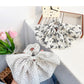 Gifty scrunchie styled in a ponytail with vintage floral pattern