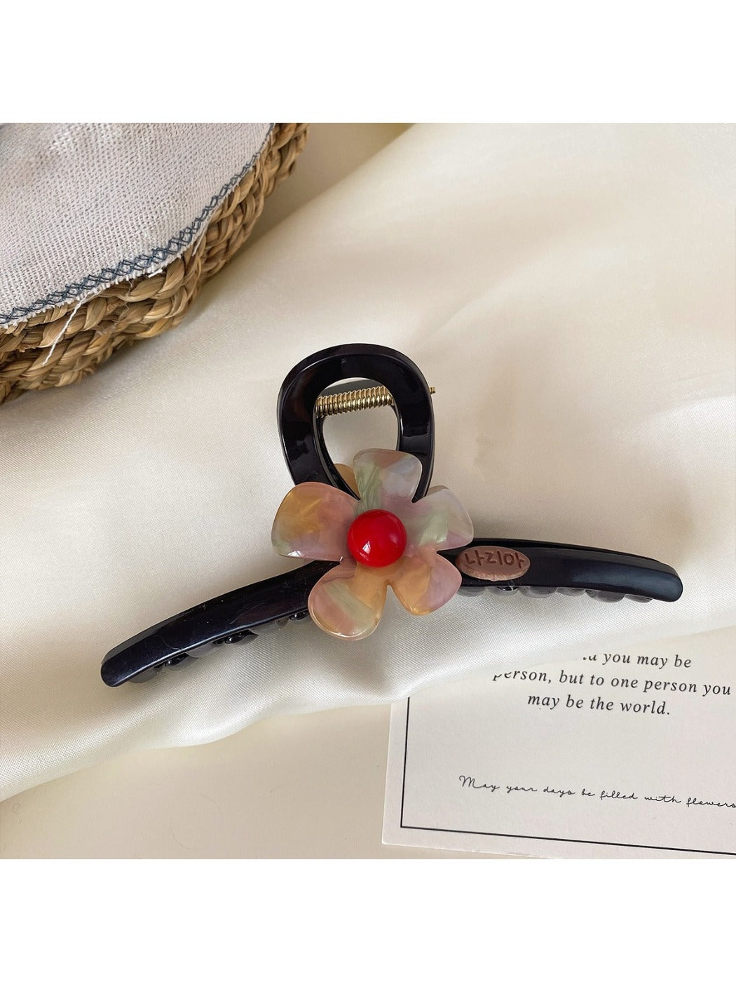 Beau claw clip worn in hair, showcasing size and floral design