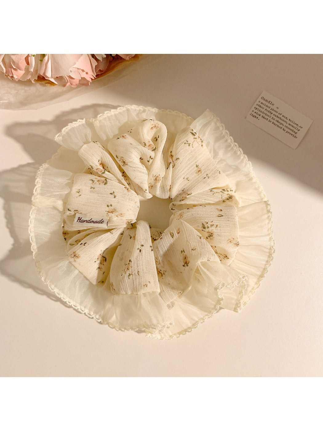 Gifty scrunchie in vintage floral print wrapped around a ponytail
