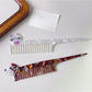 Top view of Camerow creative hair comb highlighting glossy finish