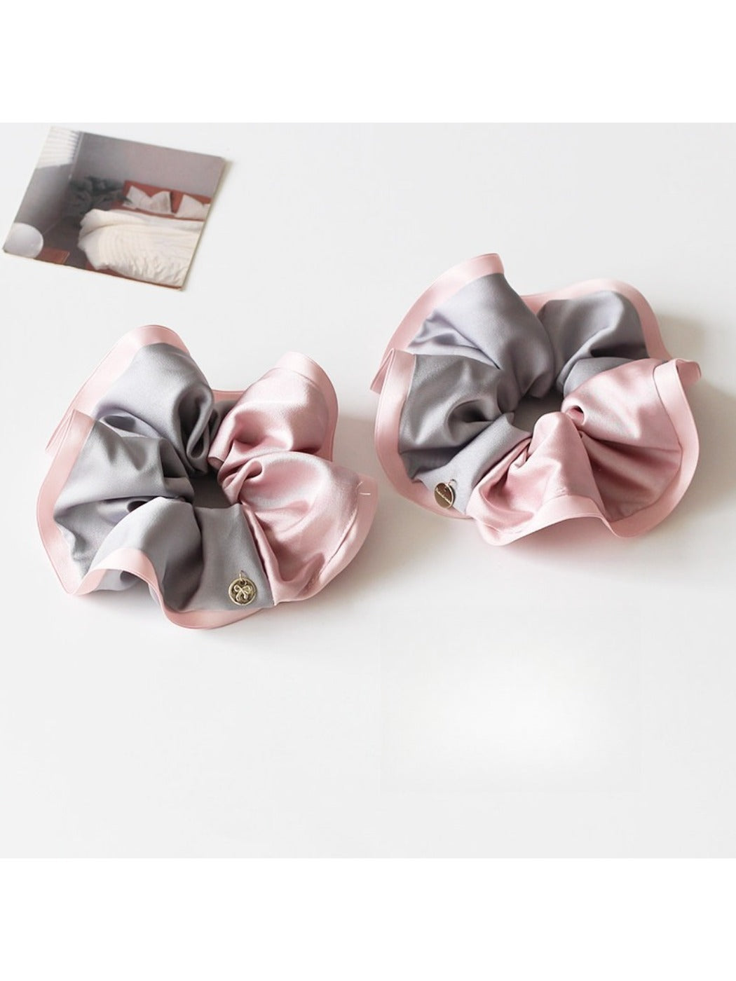 Gifty scrunchie displayed on a white background highlighting its shape and colors