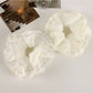 Gifty scrunchie showing layered design with pink and white fabric textures