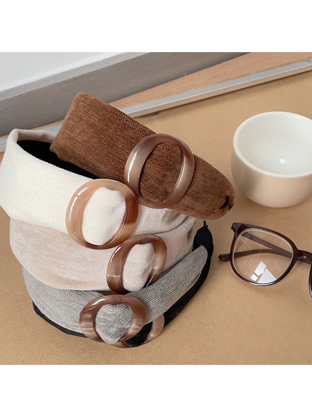 Close-up of Gifty wide band circular headband showing fabric texture and stitching