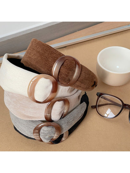 Close-up of Gifty wide band circular headband showing fabric texture and stitching