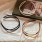 Close-up of Gifty acrylic headband showing irregular shape and smooth finish