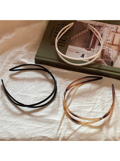 Close-up of Gifty acrylic headband showing irregular shape and smooth finish
