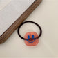 Gifty - Block Smiley Face Hair Tie
