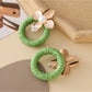 Earedge round floral pendant earrings displayed on a white background