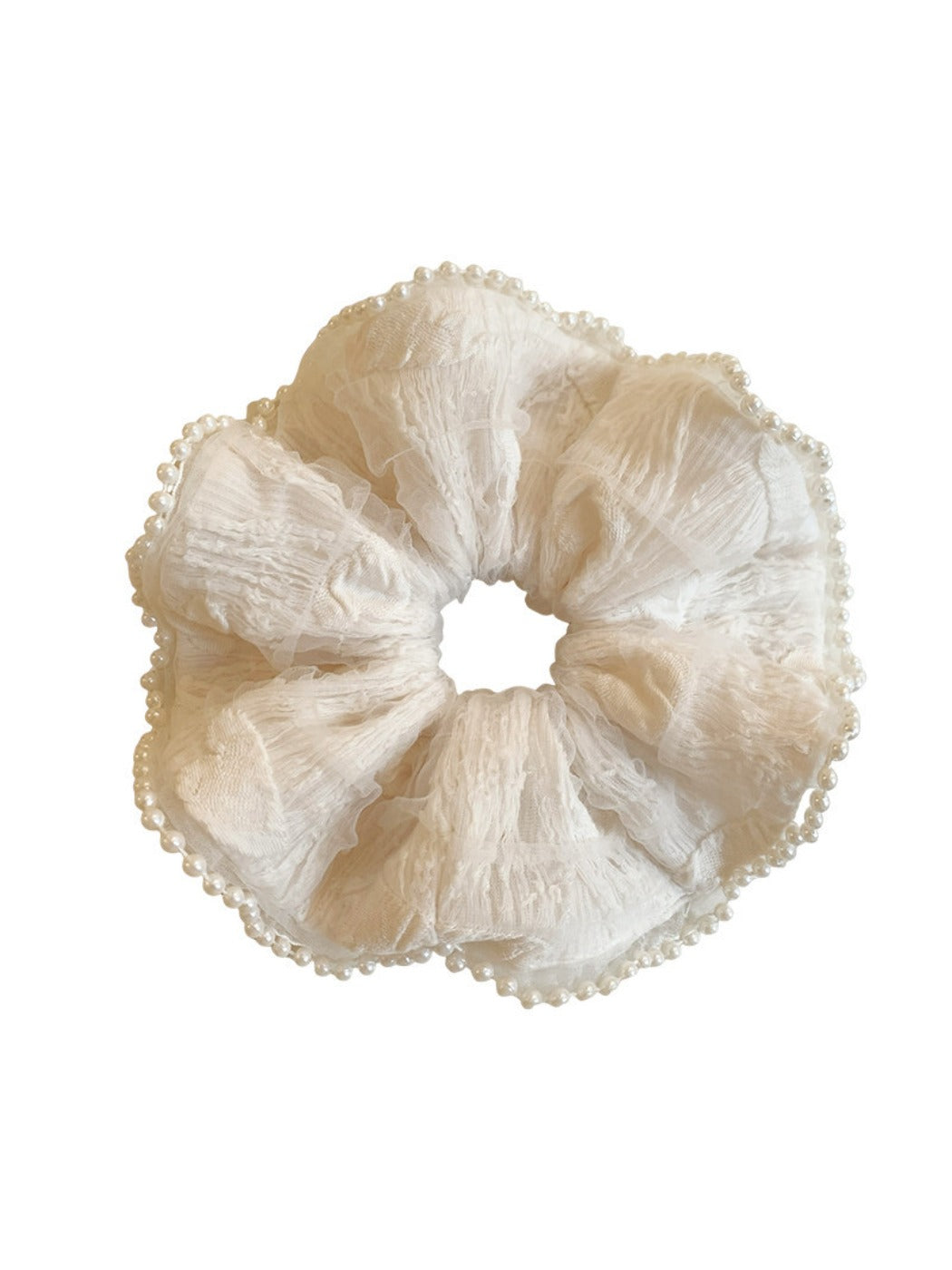 Beige ruffle scrunchie displayed on a white background