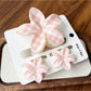 Beau flower claw clips displayed in pastel pink, yellow, green, blue, and purple