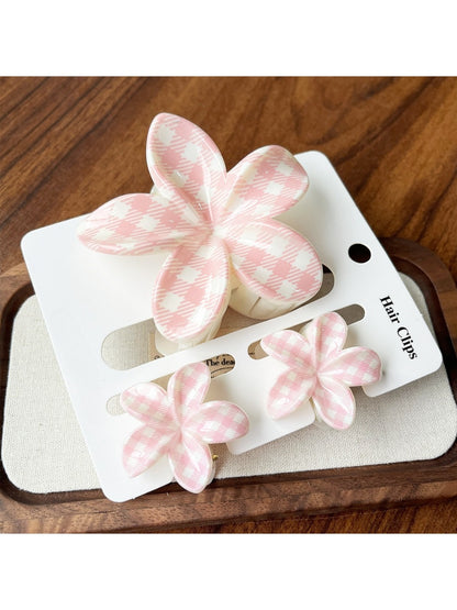 Beau flower claw clips displayed in pastel pink, yellow, green, blue, and purple
