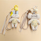 Fabric keychain shaped like a white rabbit with stitched details and a metal ring
