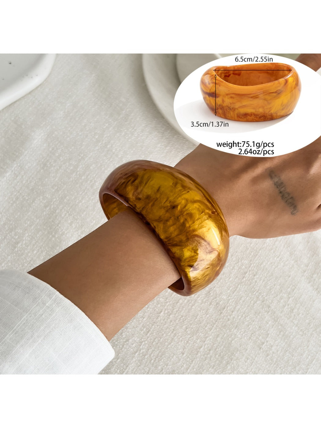 Lovra vintage polished irregular bangle bracelet displayed with soft lighting