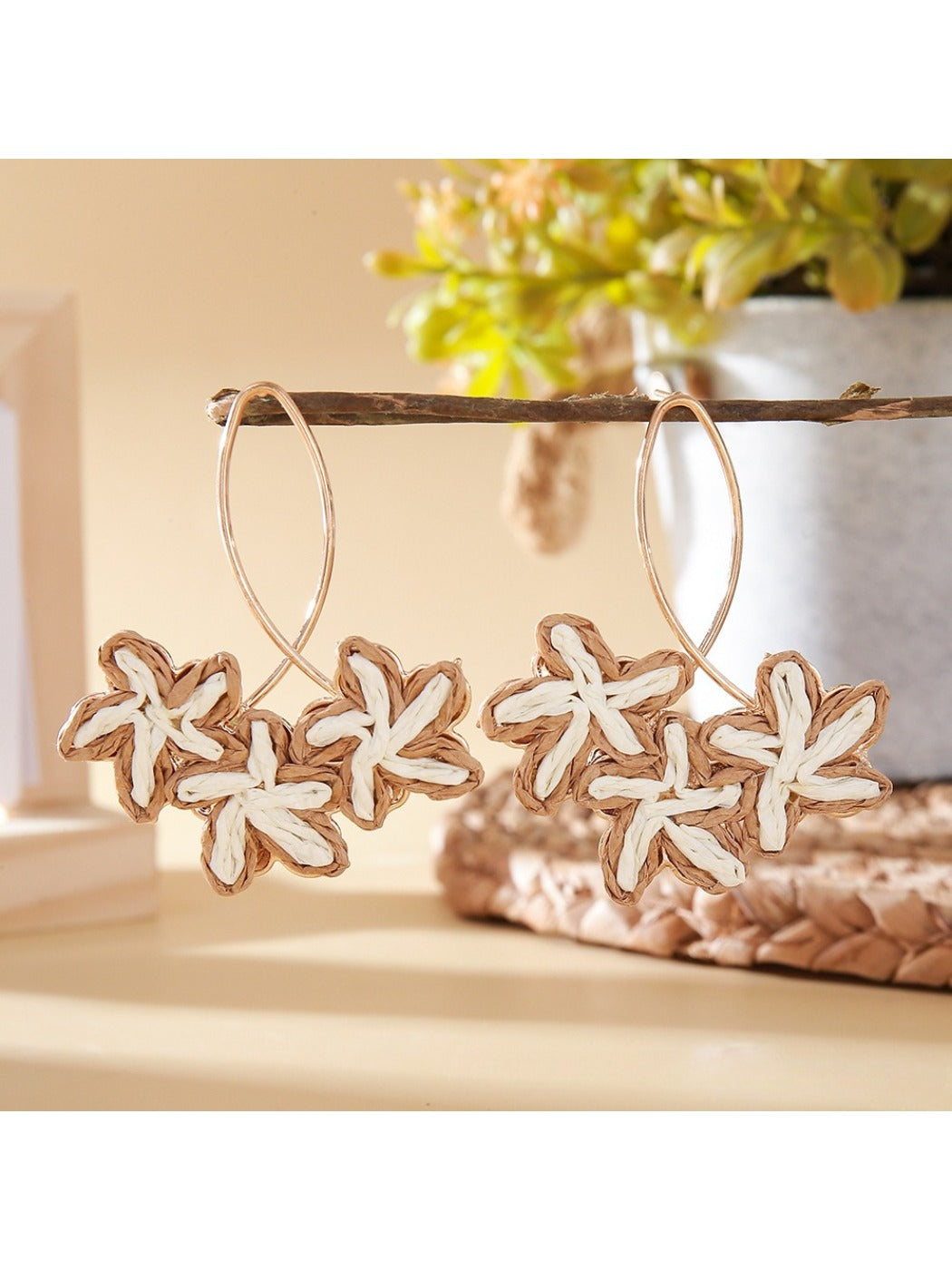 Earedge Sweet Flower Shaped Drop Earrings worn on a model's ear with natural lighting