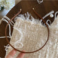 Gifty headband in soft beige color folded to show flexibility and fabric quality