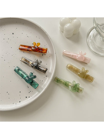Side view of Beau sweet cute acetate hair clip highlighting thickness and texture