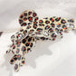 Beau butterfly claw clip with leopard print shown in natural light