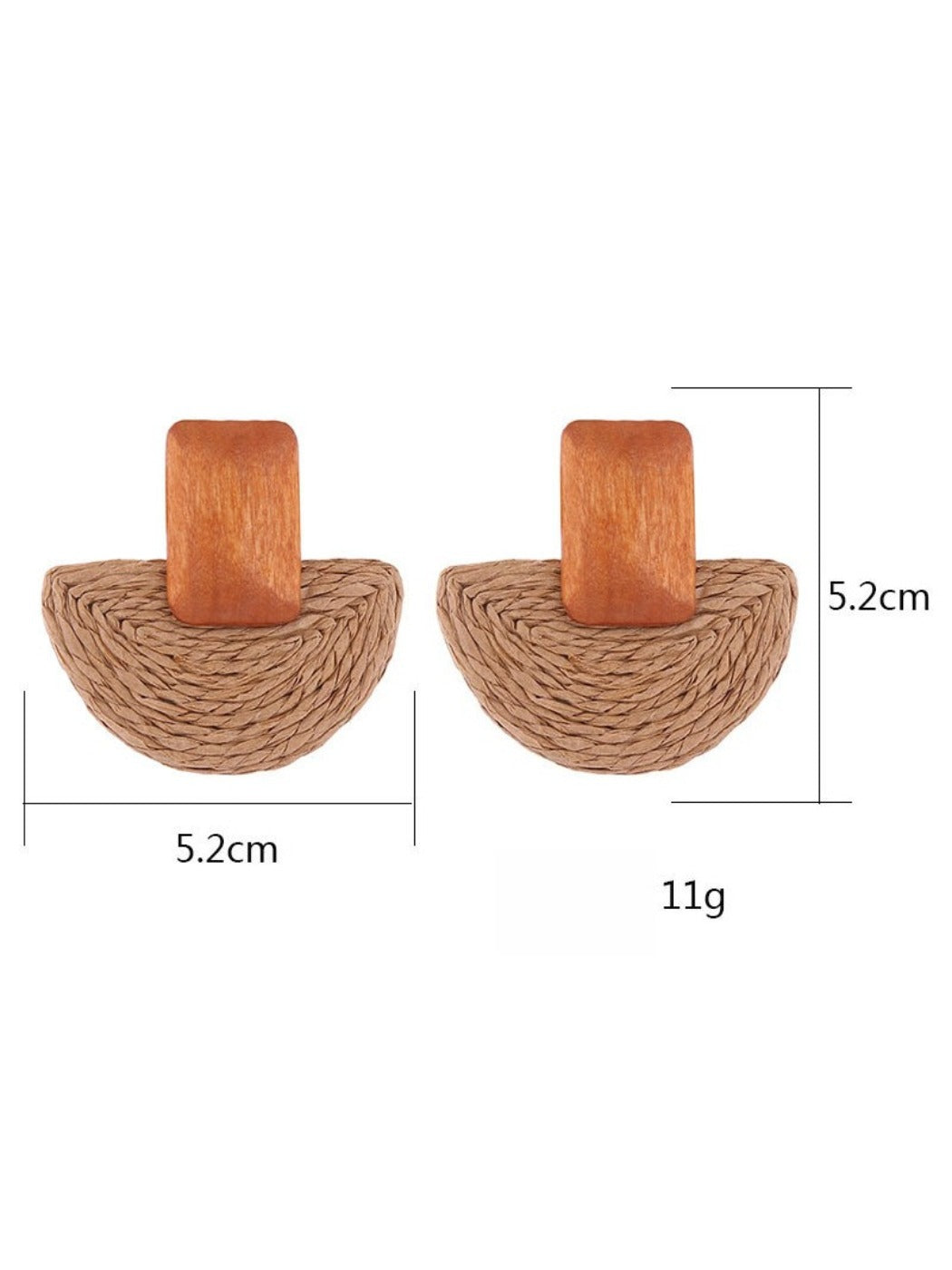 Pair of raffia mushroom shaped stud earrings displayed on a wooden surface