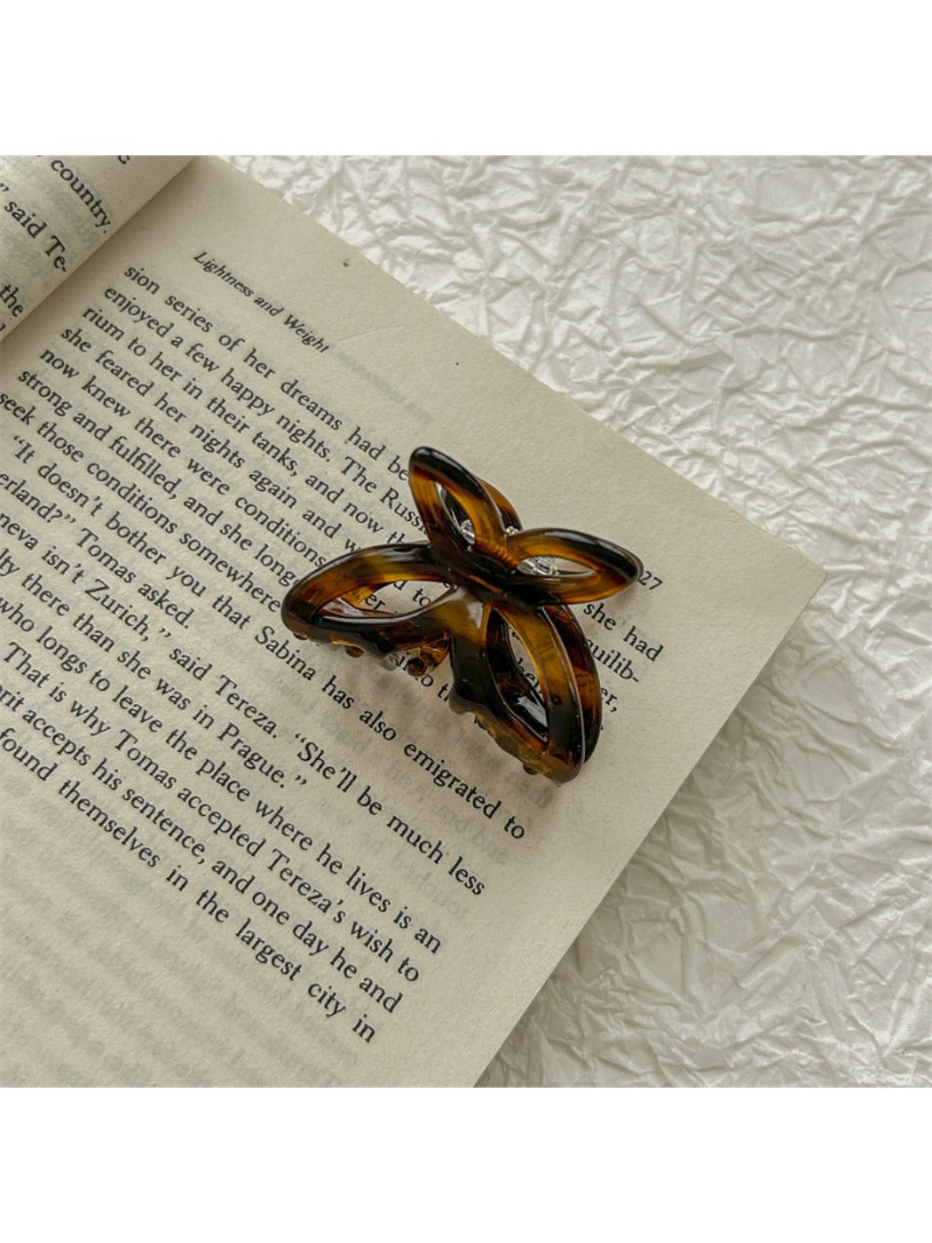 Beau butterfly claw clip held in hand to show size and scale