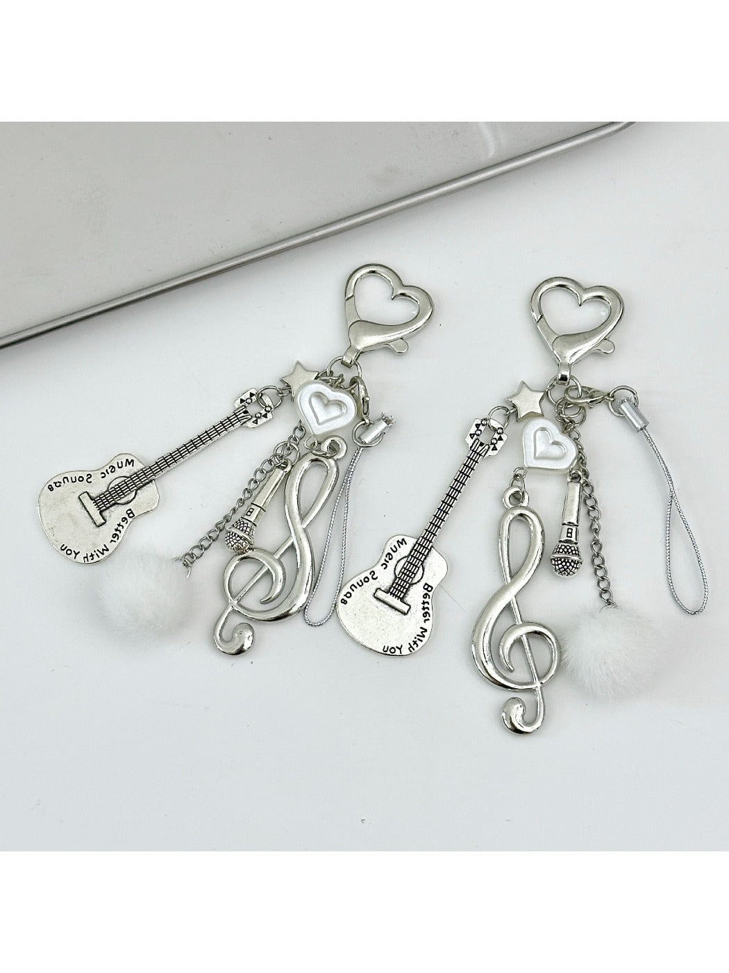 Keypus music style note keychain with black and white musical note design on metal ring