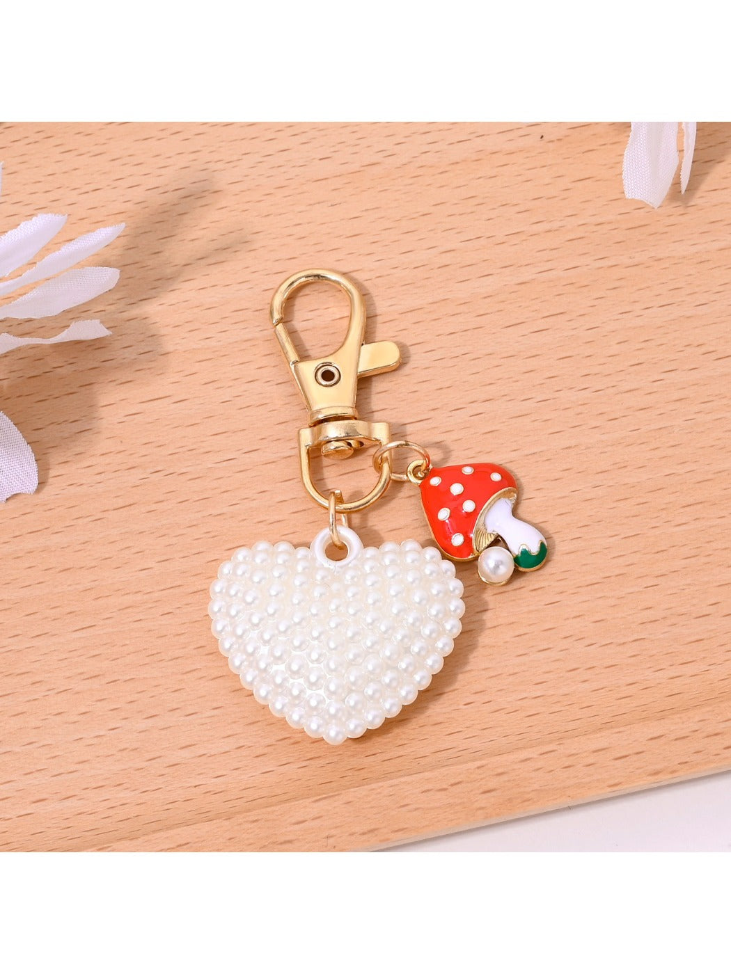 Side view of red heart shaped bag charm keychain highlighting thickness and texture