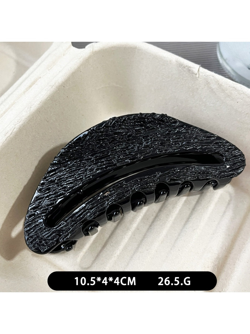Top view of Beau black acetate claw clip showing smooth glossy finish