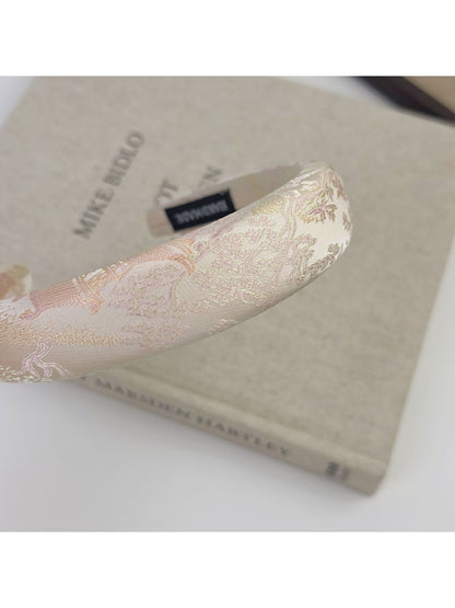 Close-up of embroidered flower details on Gifty fabric headband