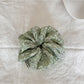 Gifty Sweet Green Style Scrunchie paired with matching green accessories on a wooden surface