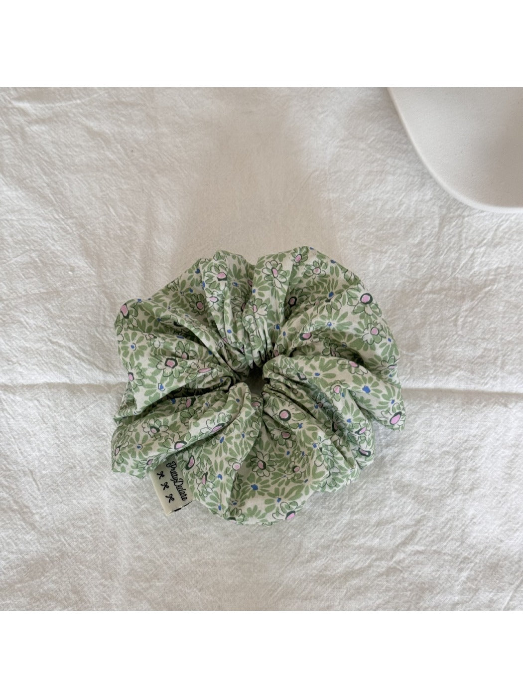 Gifty Sweet Green Style Scrunchie paired with matching green accessories on a wooden surface