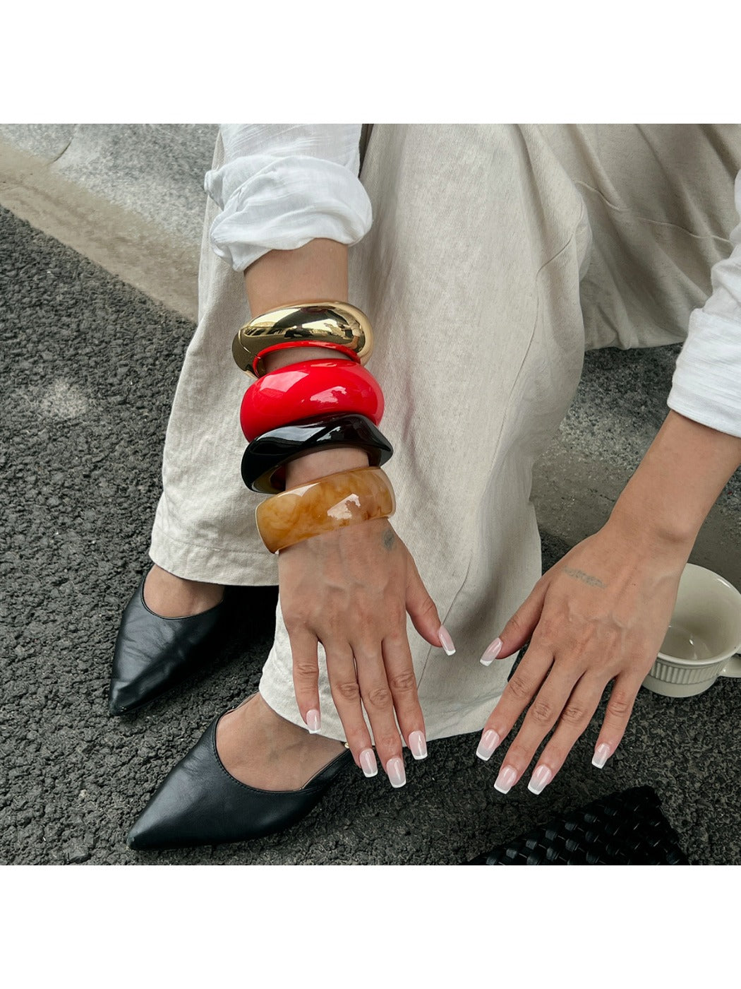 Side view of Lovra round geometric bracelet displaying smooth edges and clasp