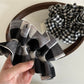 Black and white check vintage scrunchie styled in a ponytail