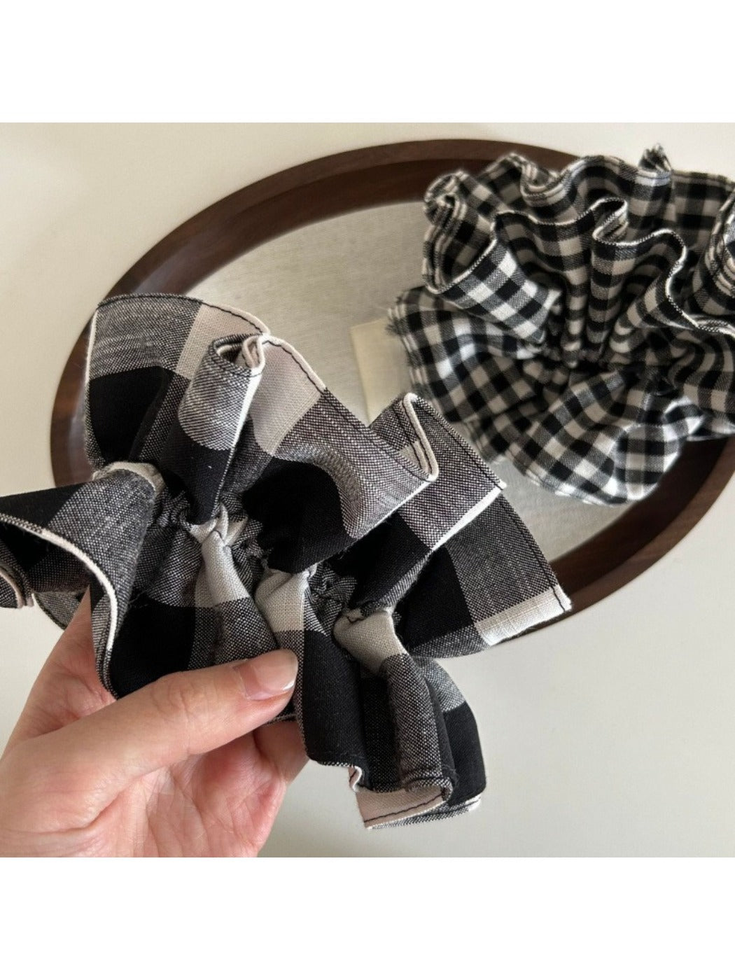 Black and white check vintage scrunchie styled in a ponytail