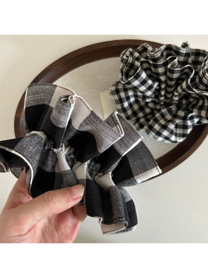 Black and white check vintage scrunchie styled in a ponytail