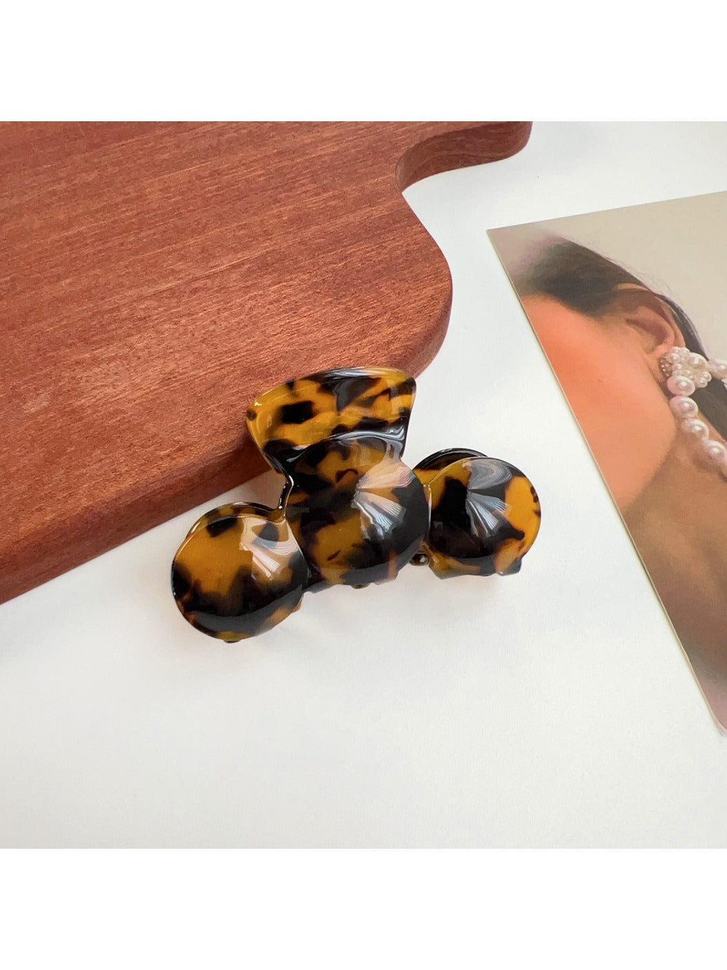 Model showing side profile with Beau hair claw clip holding hair up